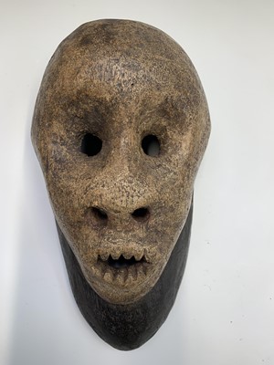 Lot 70 - An unusual carved wood tribal face mask,...