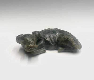 Lot 156 - A Chinese soapstone carving of a recumbent...