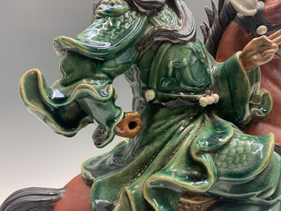 Lot 155 - A large Chinese pottery figure of a warrior on...