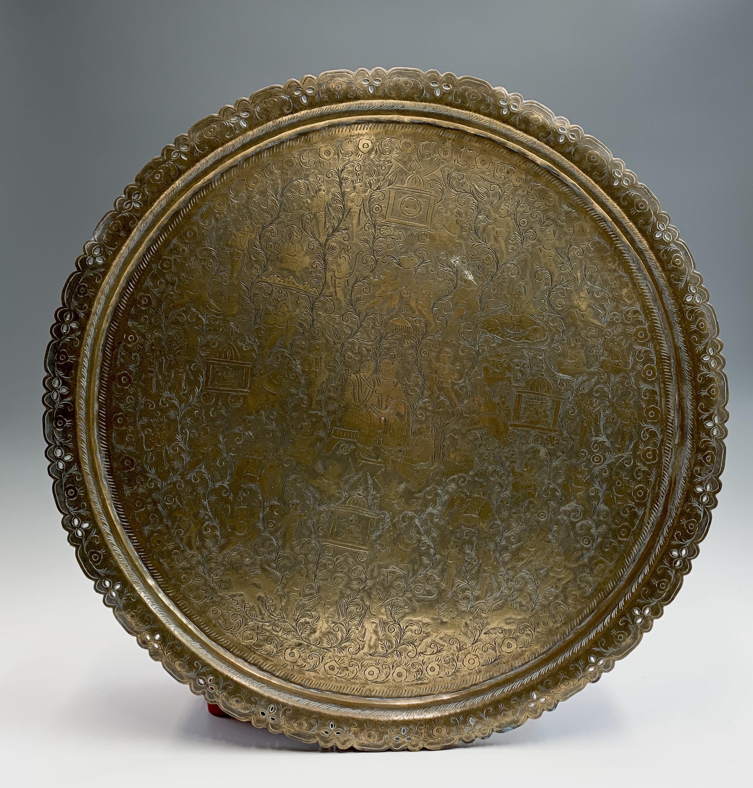 Lot 259 - A large Indian brass tray engraved with a