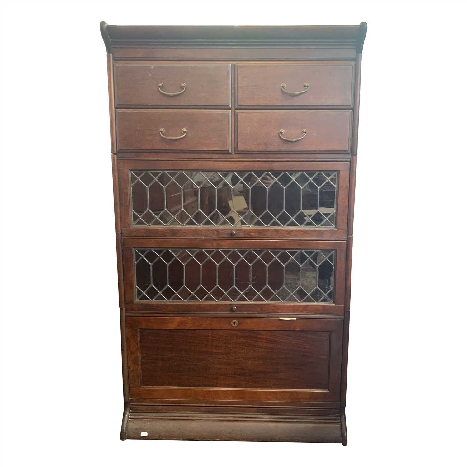 Lot 3362 - A mahogany sectional bookcase, the top