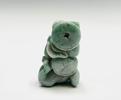 Lot 181 - A Chinese jade figure of a monkey beneath a...