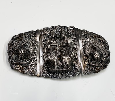 Lot 1027 - A Burmese silver buckle, with figures flanked...