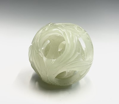 Lot 192 - A carved greenstone puzzle ball, diameter 5.5cm.