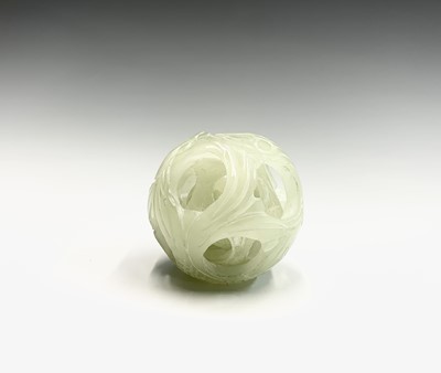 Lot 192 - A carved greenstone puzzle ball, diameter 5.5cm.