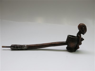 Lot 87 - An African wooden pipe, with carved figural...