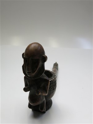 Lot 87 - An African wooden pipe, with carved figural...