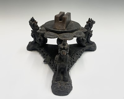 Lot 22 - A Burmese carved hardwood stand, mounted with...