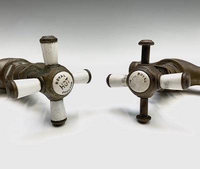 Lot 27 - Two brass Royal Doulton taps, another brass...