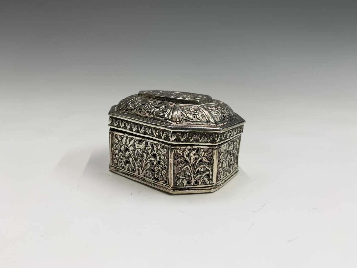 Lot 1037 - An Indian silver pierced trinket box, circa