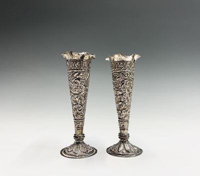 Lot 1039 - A pair of Indian silver bud vases, early 20th...
