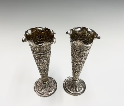 Lot 1039 - A pair of Indian silver bud vases, early 20th...