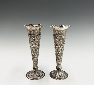 Lot 1039 - A pair of Indian silver bud vases, early 20th...