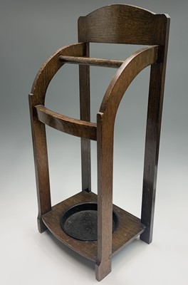 Lot 197 - An Art Deco period oak stick stand, bearing...