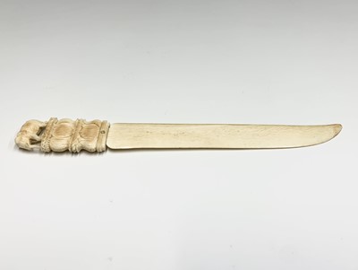 Lot 1060 - An Indian carved ivory letter opener, late...