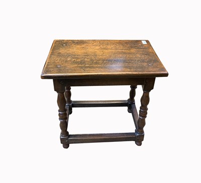 Lot 3100 - A 17th century style oak stool, the...