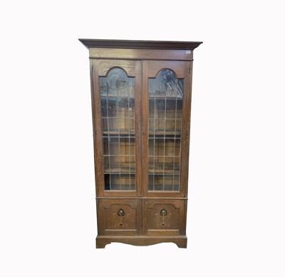 Lot 3101 - An Art Nouveau oak bookcase, with a pair of...