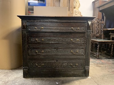 Lot 40 - A Georgian carved oak chest of drawers, with...