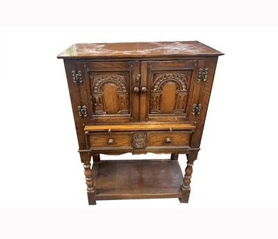 Lot 3117 - A 17th century style oak livery cupboard, 20th...