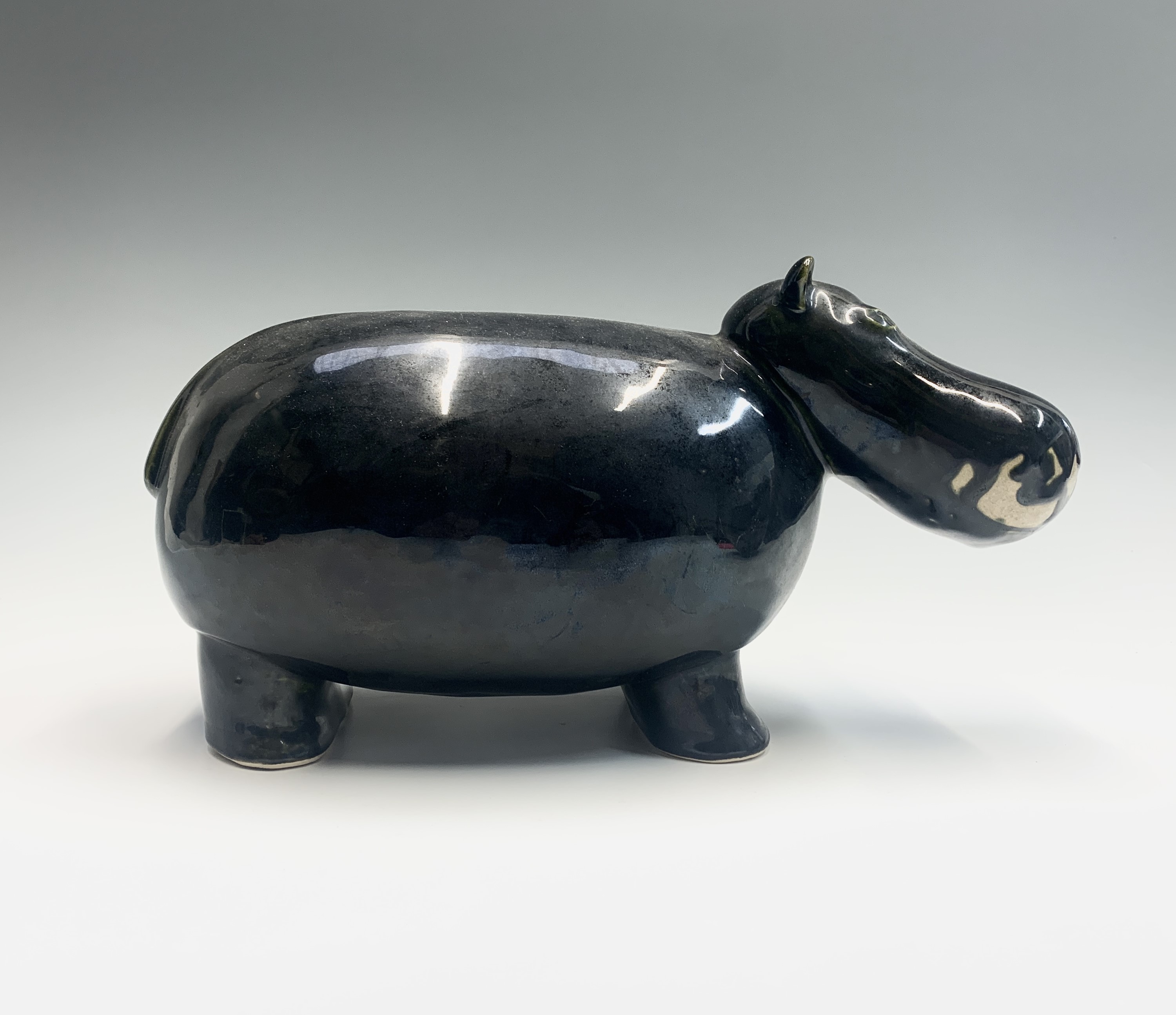 Lot 997 - A glazed pottery sculpture of a hippo.