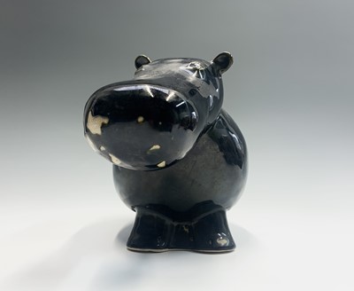 Lot 997 - A glazed pottery sculpture of a hippo. Length...