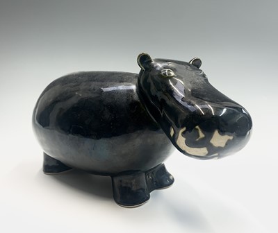 Lot 997 - A glazed pottery sculpture of a hippo. Length...