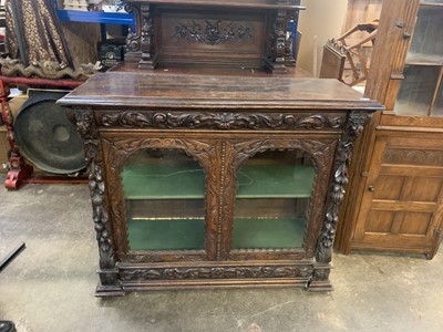 Lot 63 - A Victorian carved oak display cabinet, with...
