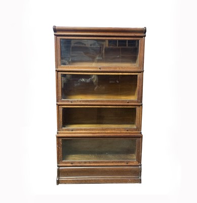 Lot 3125 - A Globe Wernicke oak four section bookcase,...