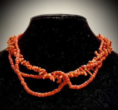 Lot 209 - A Chinese coral necklace.
