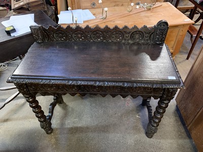 Lot 62 - A Victorian dark oak side table, with carved...