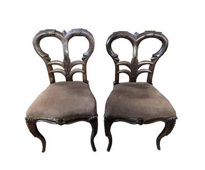 Lot 3176 - A set of four unusual rosewood dining chairs,...