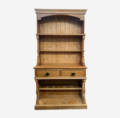 Lot 100 - A pine kitchen dresser, the rack with turned...