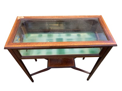 Lot 3140 - An Edwardian inlaid mahogany display table,...