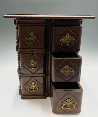 Lot 73 - A Continental walnut miniature chest of...