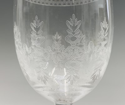 Lot 1030 - A set of eight Edwardian etched wine glasses,...