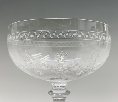 Lot 1030 - A set of eight Edwardian etched wine glasses,...