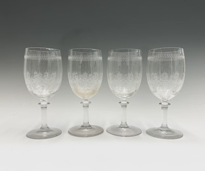 Lot 1030 - A set of eight Edwardian etched wine glasses,...