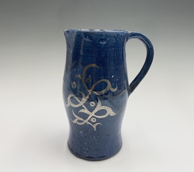 Lot 1026 - A blue glazed stoneware jug by Alfred and...