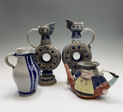 Lot 1027 - A pair of German Westerwald stoneware jugs of...