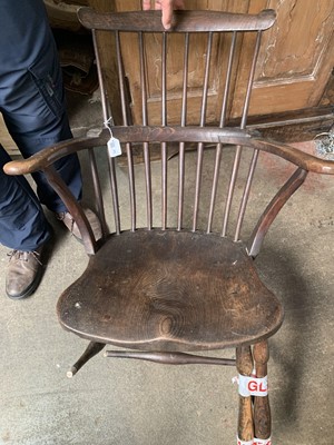 Lot 75 - An ash and elm 'comb back' Windsor armchair,...