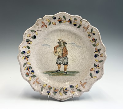 Lot 1042 - A French faience pottery plate, 19th century,...