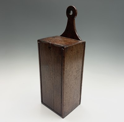 Lot 58 - A George III oak candle box, with sliding...