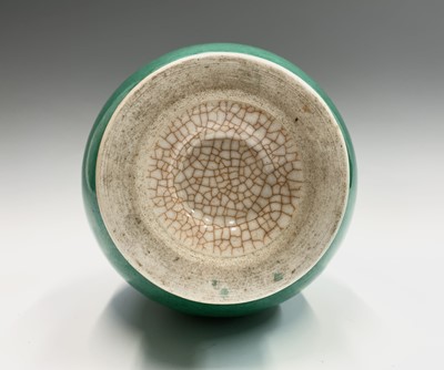 Lot 71 - A Chinese green crackle glazed earthenware...