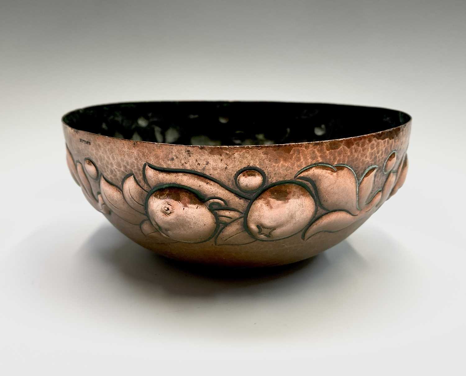 Lot 312 - A Newlyn copper bowl, repousse decorated with...