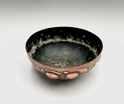 Lot 312 - A Newlyn copper bowl, repousse decorated with...