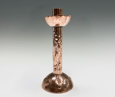 Lot 315 - A Newlyn copper candlestick, on a planished...