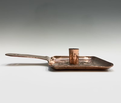 Lot 316 - A Newlyn copper chamber candlestick, repousse...