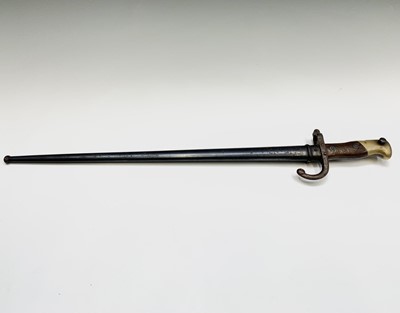 Lot 97 - A French Gras bayonet, with two piece wood...