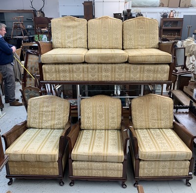 Lot 3197 - A mahogany bergere suite, comprising a sofa...