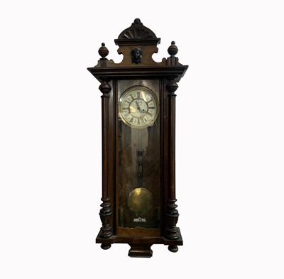 Lot 2933 - A Vienna type walnut twin weight wall clock,...